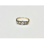 An 18ct gold five stone diamond ring, the principal stone weighing 0.