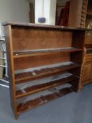 A set of early 20th century stained pine open bookshelves