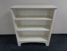 A set of painted open shelves