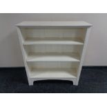 A set of painted open shelves