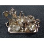 A plated twin handled gallery tray containing three decanter labels,