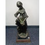 A contemporary bronze figure - Female figure with dog on base