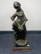 A contemporary bronze figure - Female figure with dog on base