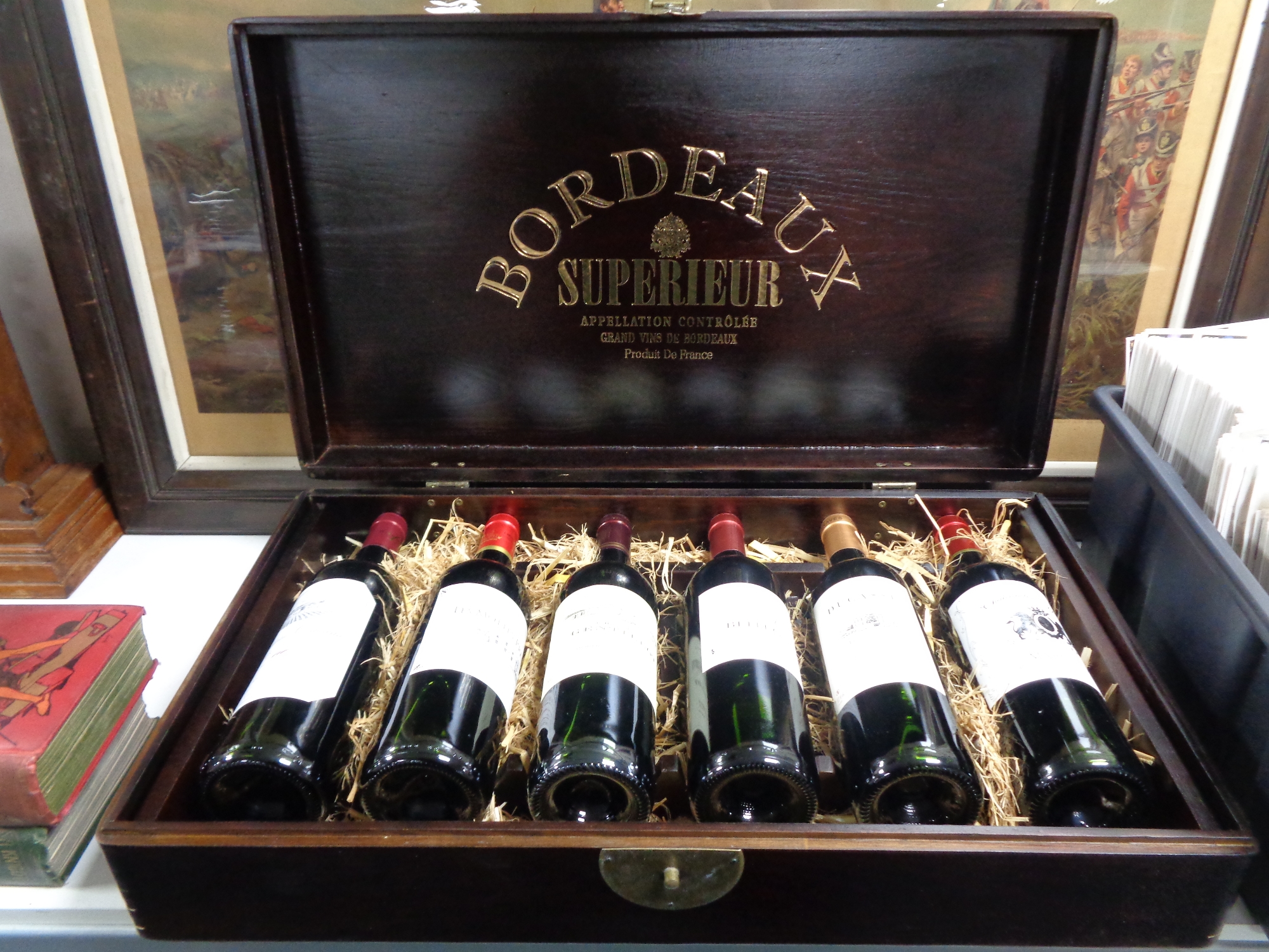 A wine casket containing six bottles of Bordeaux Superieur wine