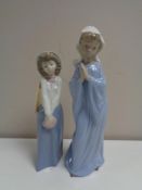 Two Nao figures - Lady in habit and lady with purse (boxed)