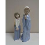 Two Nao figures - Lady in habit and lady with purse (boxed)