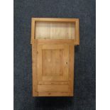 A pine counter top display cabinet and a pine wall cabinet