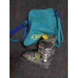 A set of slalom ski boots in carry bag CONDITION REPORT: Showing signs of use.