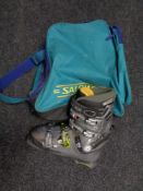 A set of slalom ski boots in carry bag CONDITION REPORT: Showing signs of use.