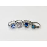 Four silver gem set rings