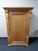 A continental oak sentry cabinet with pillar supports