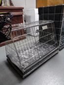 A folding metal dog cage,