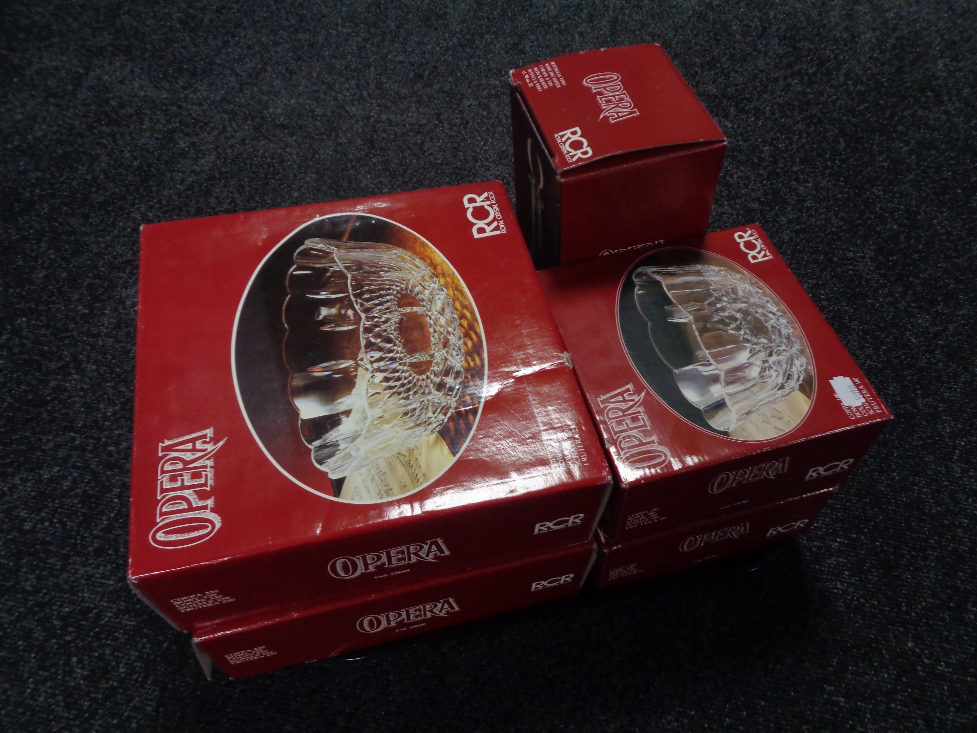 A tray of four boxed opera Royal Crystal Roc bowls together with a boxed decanter