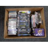 A box of DVDs and CDs