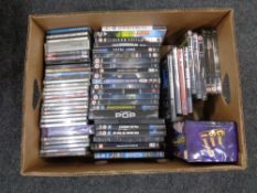 A box of DVDs and CDs