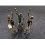 Three French spelter figures on wooden stands
