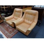A pair of mid 20th century Cornwell Norton vinyl upholstered armchairs