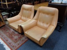 A pair of mid 20th century Cornwell Norton vinyl upholstered armchairs