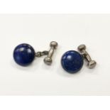 A pair of silver and lapis lazuli cuff links