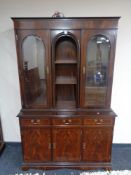 A reproduction mahogany display cabinet