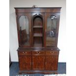 A reproduction mahogany display cabinet