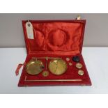 A set of vintage brass balance scales in fitted case