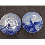 Two Delft plaques depicting fishing and windmill scene.