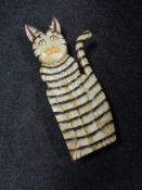 A wooden figure of a cat