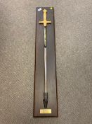 A large ornamental sword on wooden board - Cermonial Epee