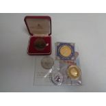 A Royal Mint Queen's 90th Birthday uncirculated £5 coin together with a one ounce silver two pound