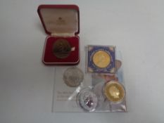 A Royal Mint Queen's 90th Birthday uncirculated £5 coin together with a one ounce silver two pound