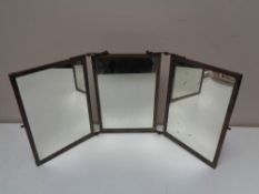 An antique brass three way folding mirror, height 31.5 cm.