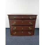 A continental painted pine four drawer chest