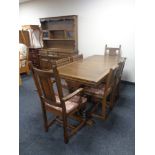 An Old Charm refectory extending table and harlequin set of six chairs