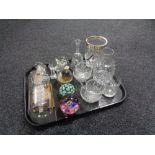 A tray of glass ware, ship in bottle, paperweights, cut glass,