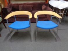 A pair of contemporary Danish design Paustian armchairs on metal legs