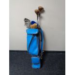 A twentieth century golf bag of half set of irons,