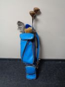 A twentieth century golf bag of half set of irons,