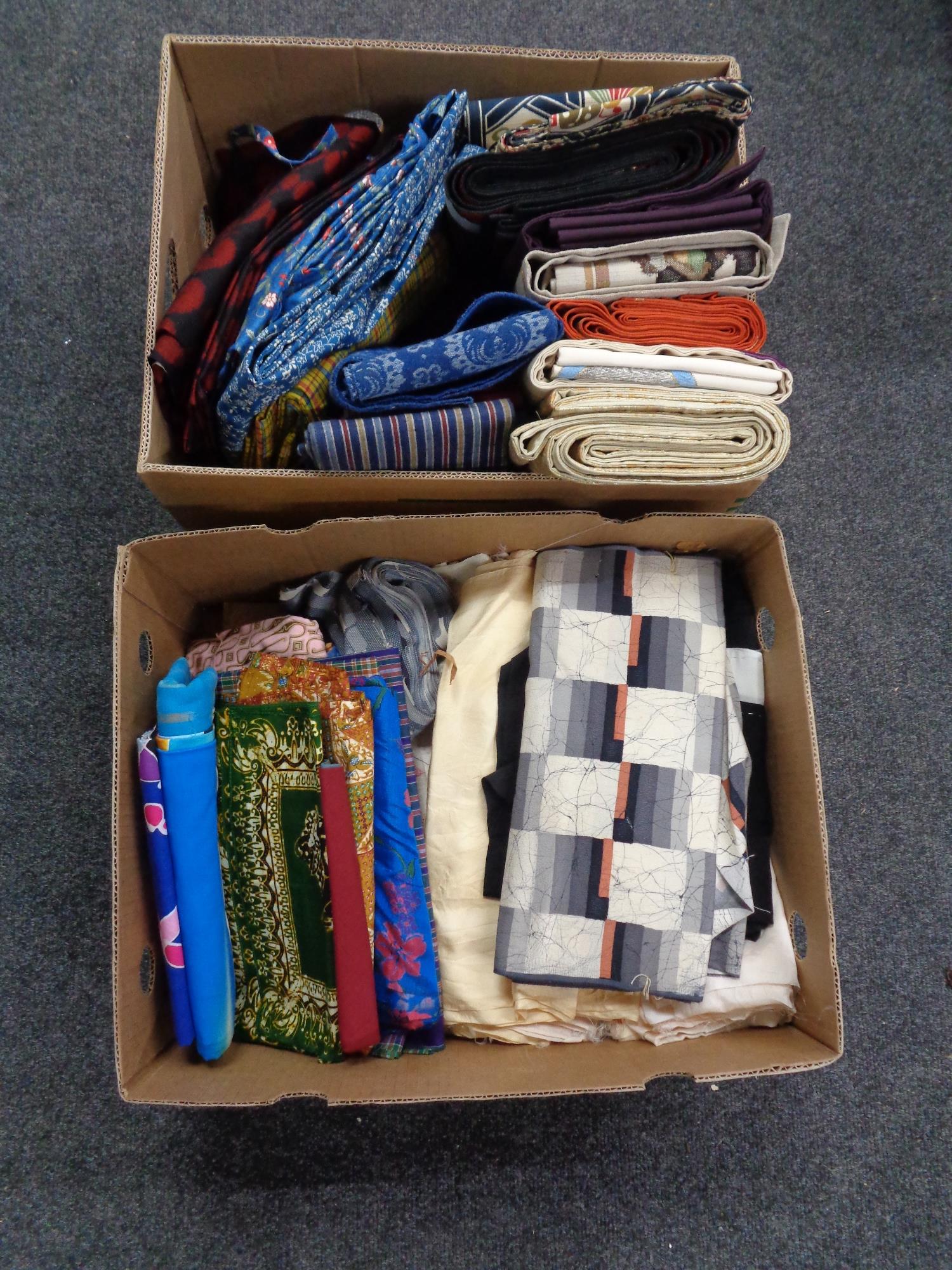 Two boxes of material and fabrics