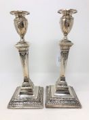 A pair of Edwardian Neo-Classical loaded silver candlesticks, Walter Latham & Son, Sheffield 1902,