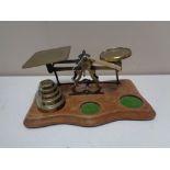 A set of twentieth century brass postal scales and weights