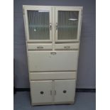 A mid 20th century Shefco painted kitchen cabinet