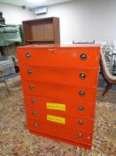 A red painted six drawer mid century chest of drawers