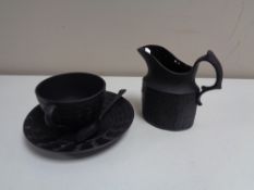 Four pieces of black Wedgwood Jasper ware, tea cup, saucer,