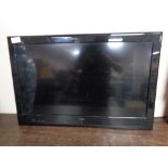 An Alba 32 inch LCD TV (no remote or table stand)