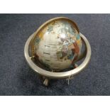 A Gemstone globe on brass stand