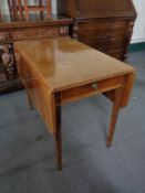 An antique mahogany Pembroke table