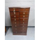 A late Victorian mahogany fourteen-drawer index chest.