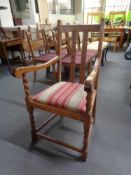 An Edwardian oak armchair