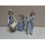 Three Nao figures - Girl with puppy,